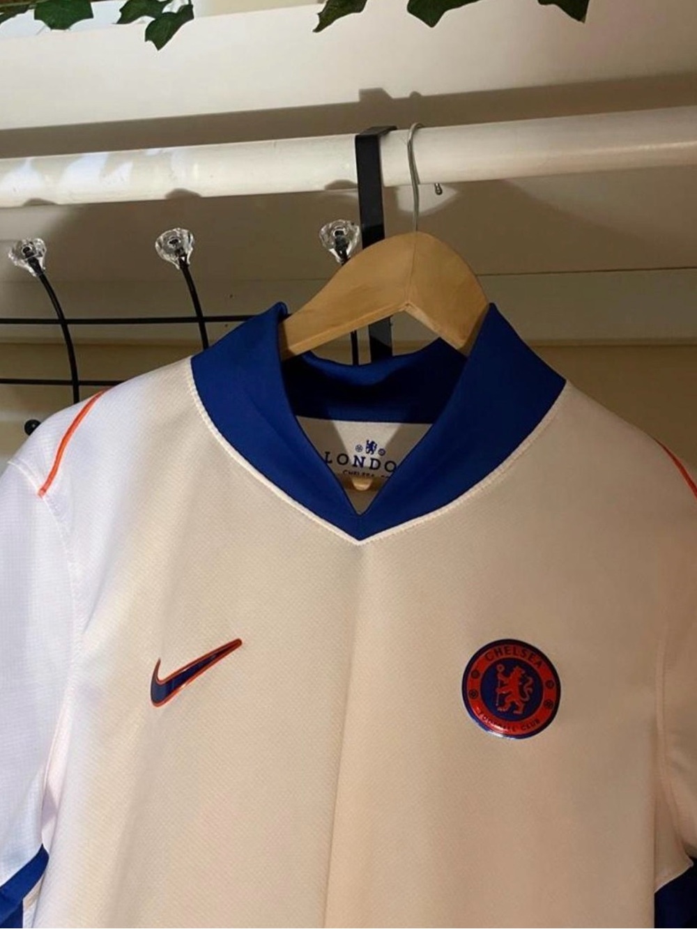 Nike Men’s White Football Jersey with Blue Collar and Orange Accents